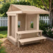 Congo Clubhouse in sand in a backyard