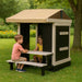 Congo Playhouse with picnic table and kids playing