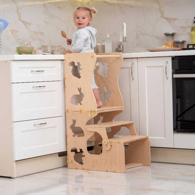 Wood and Hearts Convertible Kitchen Tower with a girl in the kitchen