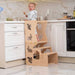 Wood and Hearts Convertible Kitchen Tower with a girl in the kitchen