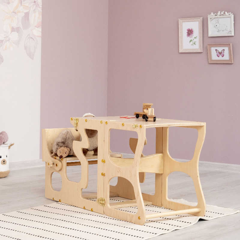 Wood and Hearts Convertible Kitchen Tower with a desk in a playroom