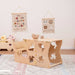 Wood and Hearts Convertible Kitchen Tower as a table in a playroom