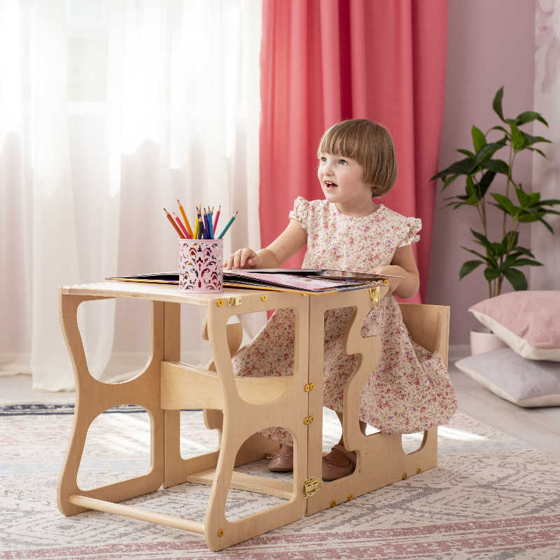 Wood and Hearts Convertible Kitchen Tower with a girl doing homework