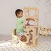 Wood and Hearts Convertible Kitchen Tower with a boy writing