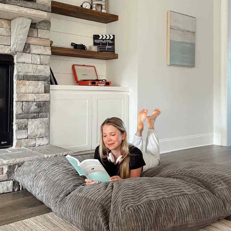 Child relaxing on CordaRoy's Terry Corduroy Children's Sensory Crash Pad