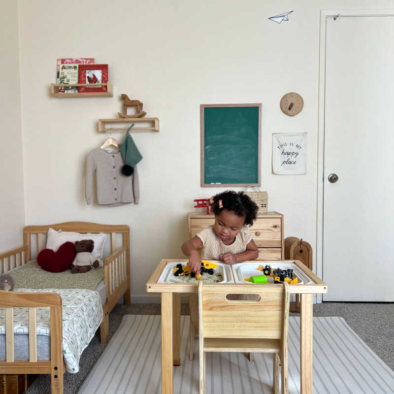 Concordia Sensory Table with girl playing