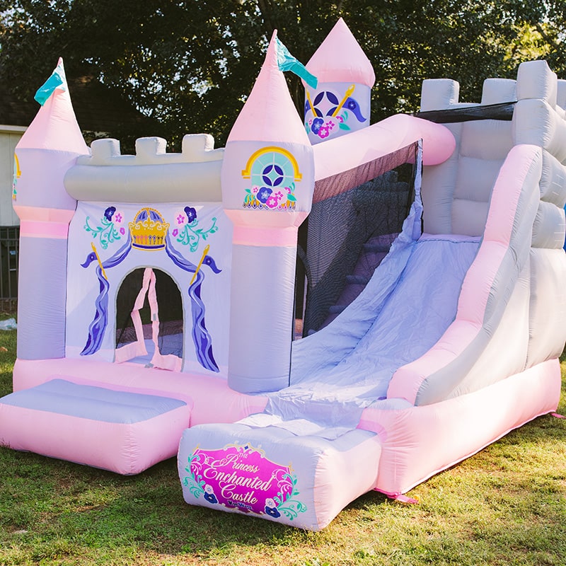 corner-view-of-kid-wise-princess-enchanted-castle-with-slide-bounce-house-out-door
