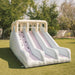 Double Slide Kids Inflatable in a yard