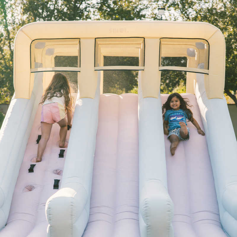 Double Slide Kids Inflatable with kids playing