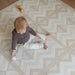 Eeveve Kilim Play Mat Soft Beige (Sand) with baby on mat