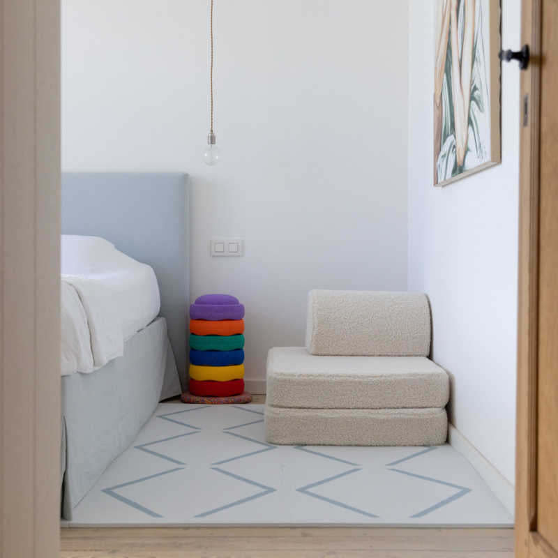 Eeveve Beni Powder Blue Play Mat in a bedroom