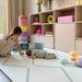 Eeveve Beni Powder Blue Play Mat in a living room with a toddler and baby