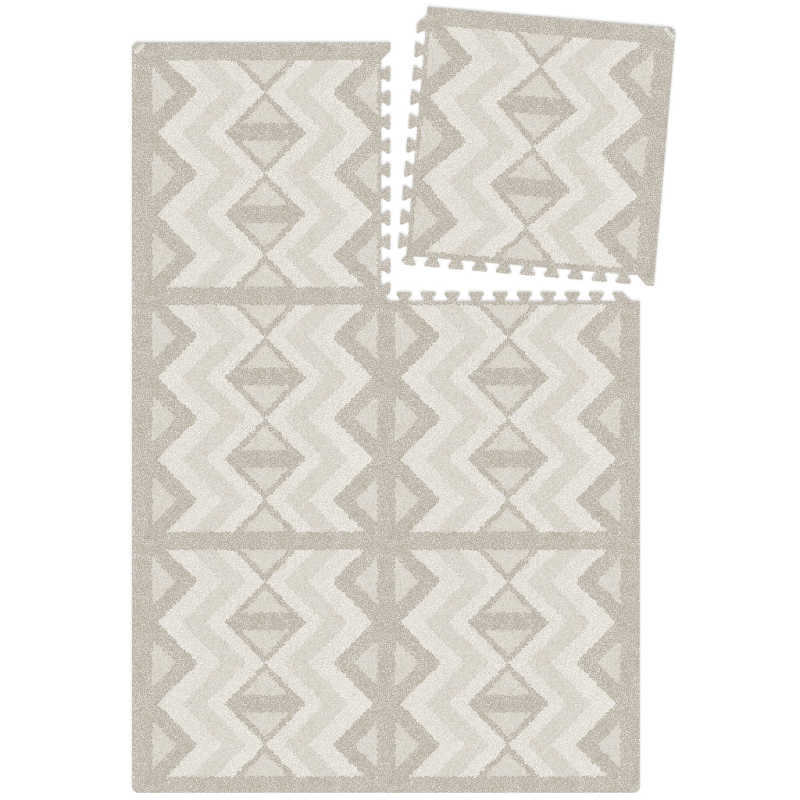 Eeveve Kilim Feather Gray Play Mat being attached