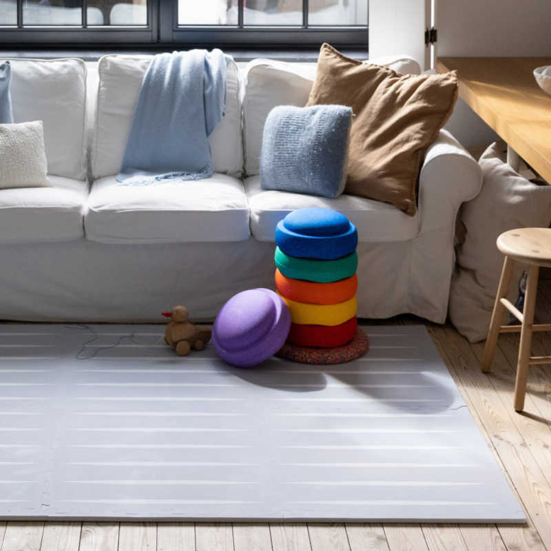 Eeveve Lucio Nordic Mist Play Mat in a living room