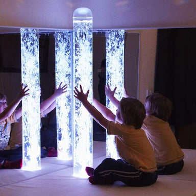 Experia Calming LED Bubble Tube Front View Showing Two Kids Amazed On The Glowing Tube