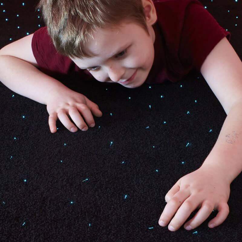 Experia LED Fiber Optic Carpet Up Close Showing A Kid Lying Face Down