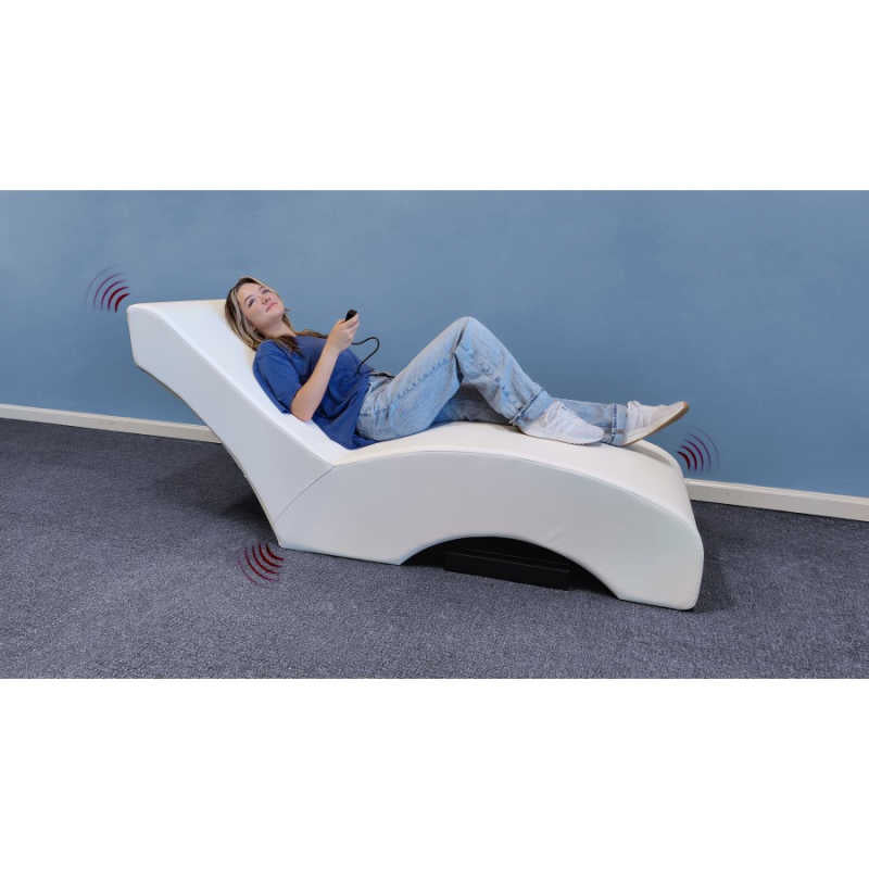 Experia Vibroacoustic lounger with girl holding controller