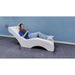 vibroacoustic lounger with a girl listening on headphones