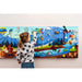 Extra Large Mountain Themed Sensory wall panel with a girl playing 