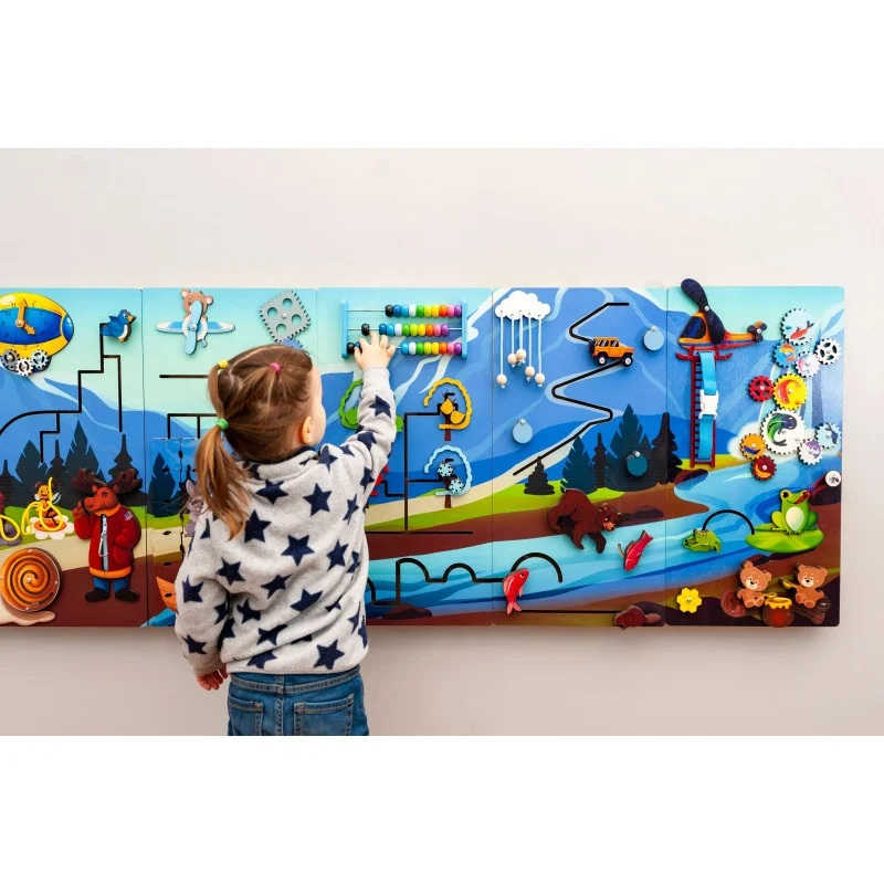Extra Large Mountain Themed Sensory wall panel with a girl playing 