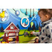 Mountain themed busy board sensory wall panel with a girl playing 