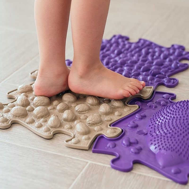 Extra Large Sensory Playmat Set with kid stepping on nuts