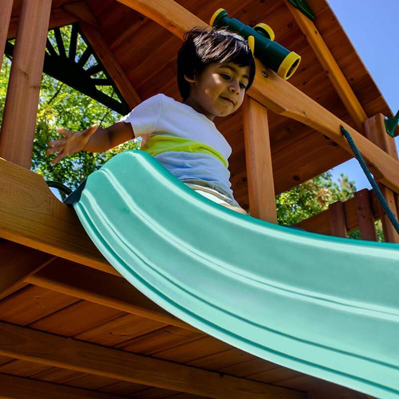 Gorilla Playsets Chateau Standard Wood Roof Showing Kids On A Picnic Table Close Up Kid On A Slide