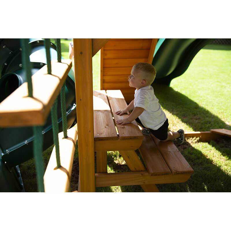 Gorilla Playsets Mountaineer Swing Set Side View Of A Boy On The Picnic Table