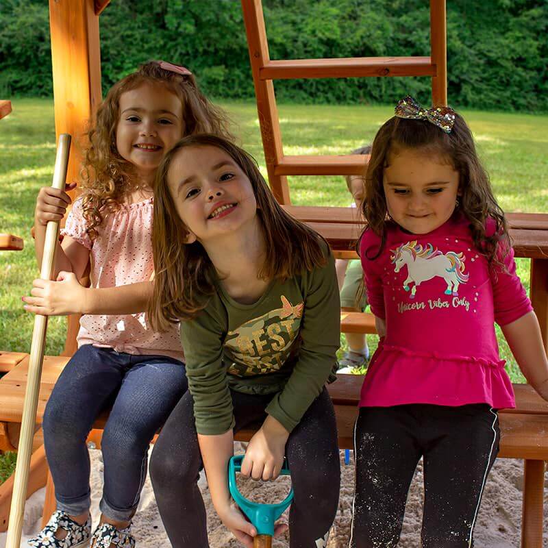 Gorilla Playsets Mountaineer Swing Set Up Close Of Kids On Picnic Table