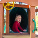 Child entering tube slide on Gorilla Outing swing set