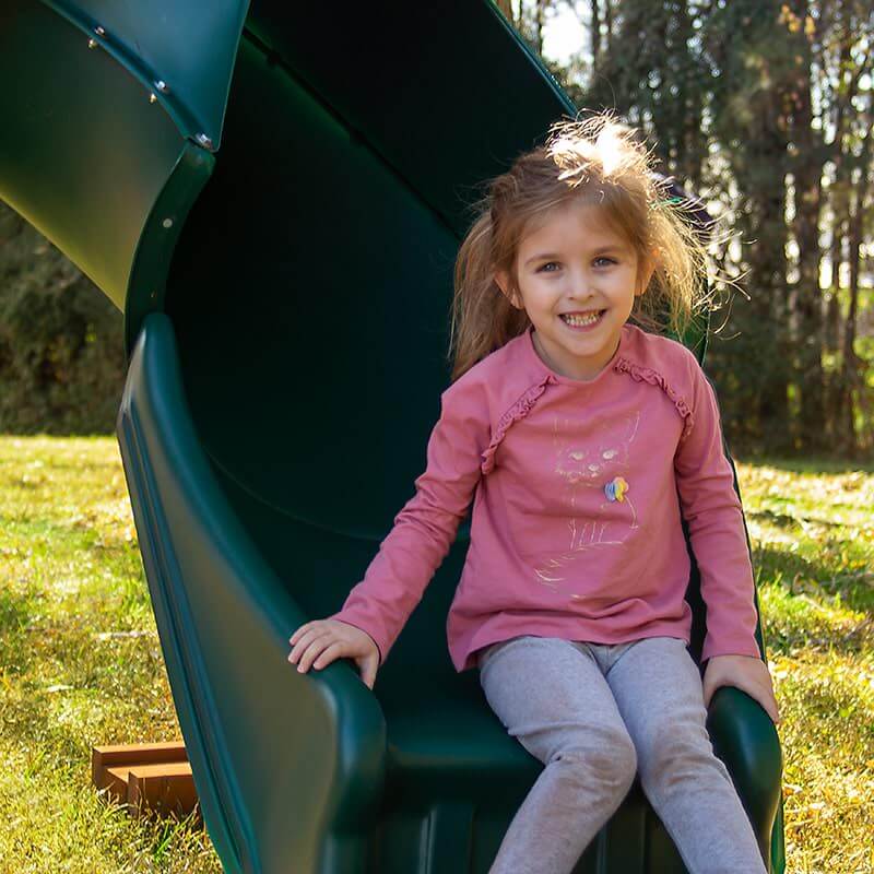 Gorilla Playsets Outing with Tube Slide Swing Set A Kid Sitting On The Edge Of Slide