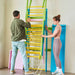 Grove Foldable Indoor Jungle Gym Wall Mounted Rainbow folded against the wall