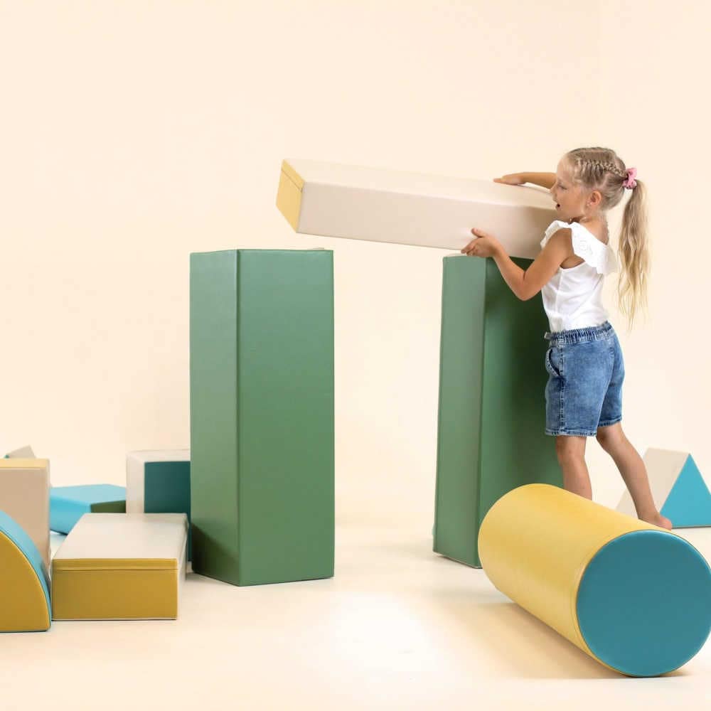 iglu soft play set in blue with girl building 