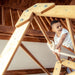 Indoor Wooden Playhouse with Triangle ladder, Slide Board and Swings with a boy playing