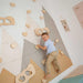 Indoor climbing wall for kids with boy climbing 