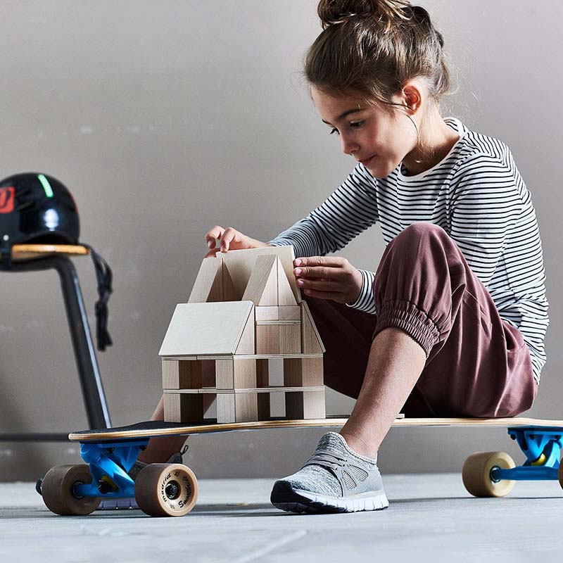 KId Playing The HABA USA Clever Up! Building Block System 4.0 On Her Skateboard