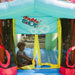 kid-sitting-inside-the-kid-wise-double-shot-bounce-house