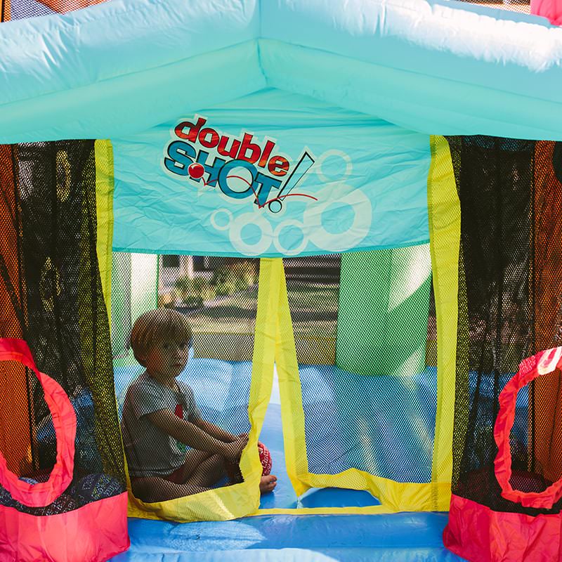 kid-sitting-inside-the-kid-wise-double-shot-bounce-house