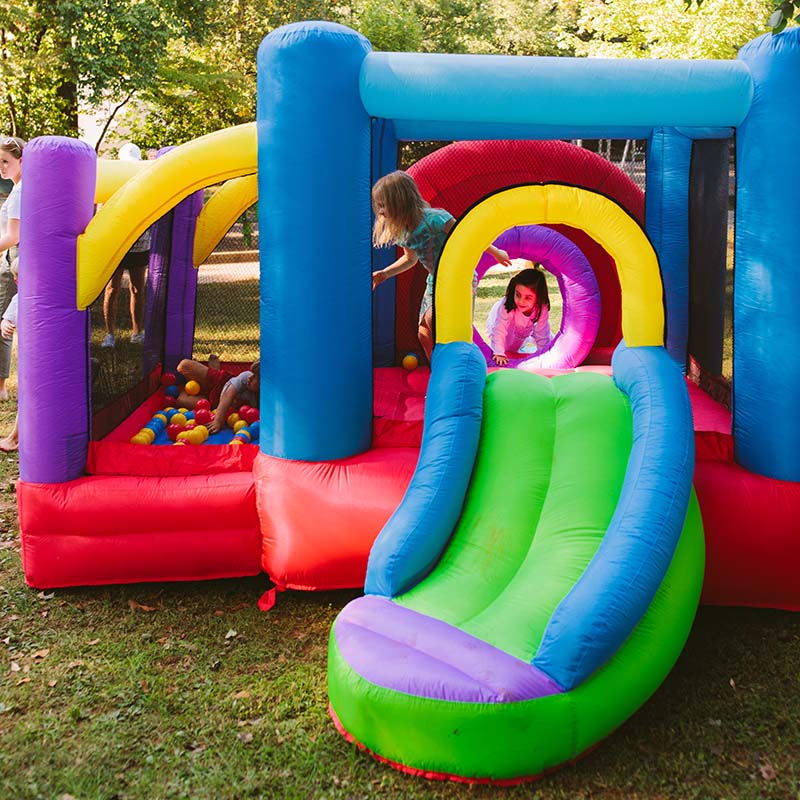 kid-wise-lucky-rainbow-bounce-house-kid-playing-inside