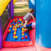 kid-wise-lucky-rainbow-bounce-house-kids-play-at-the-ball-pit