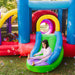 kid-wise-lucky-rainbow-bounce-house-rear-left-side-view-with-kid-sliding