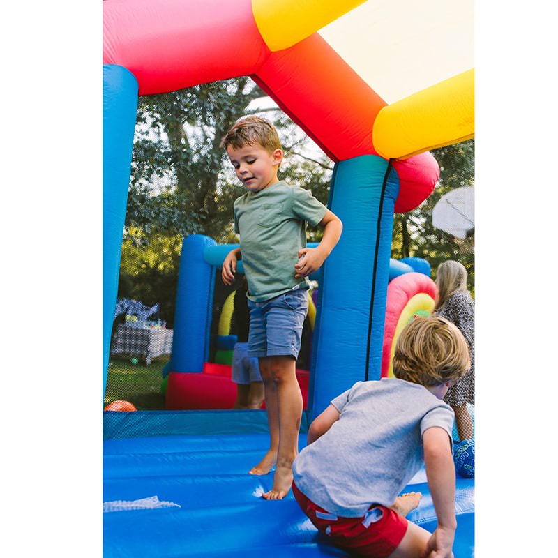kid-wise-my-little-playhouse-bounce-house-interior-kid-jumping