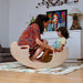 Kidodido 2 In1 Montessori Wooden Seesaw and Table Chair Set Showing A Mother And Son Swinging The Seesaw