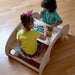 Kidodido 2 In1 Montessori Wooden Seesaw and Table Chair Set Top View Of 2 Kids Playing A Wooden Animals Puzzles