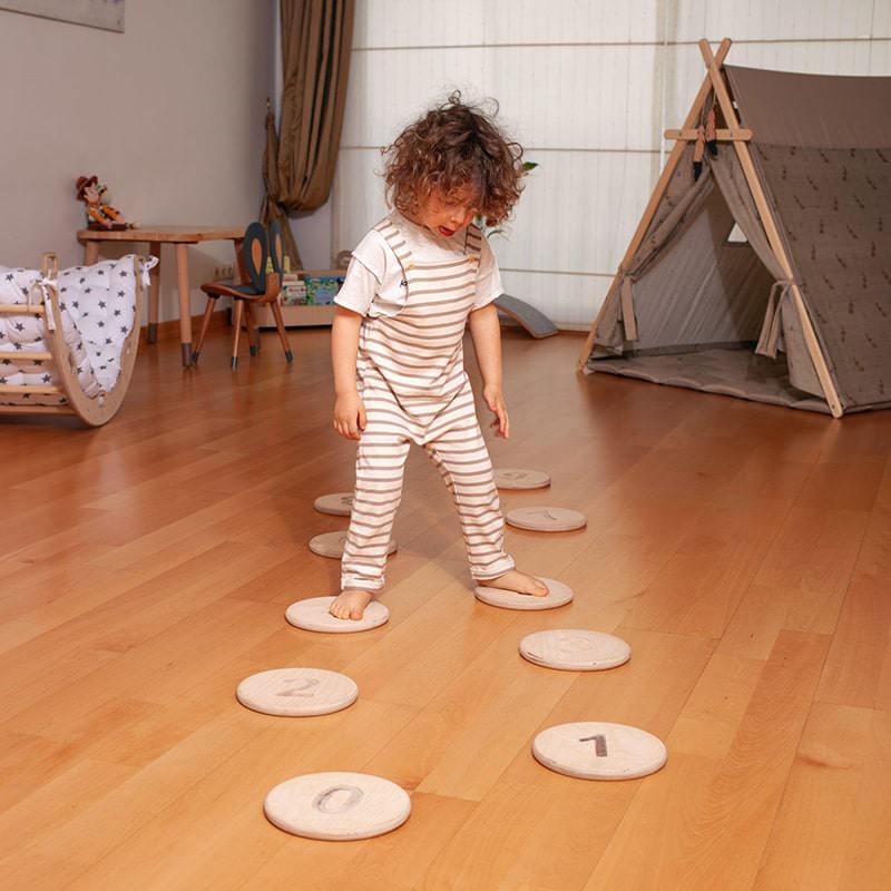 Kidodido Balance Beam and Stepping Stones Set Top View Of The Stepping Stones Showing A Kid On It