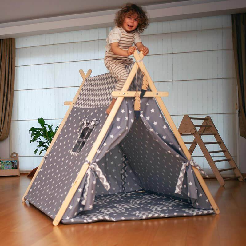 Kidodido Gray Stars Play Tent and Play Mat Front Side View Showing A Kid On Top Of The Tent