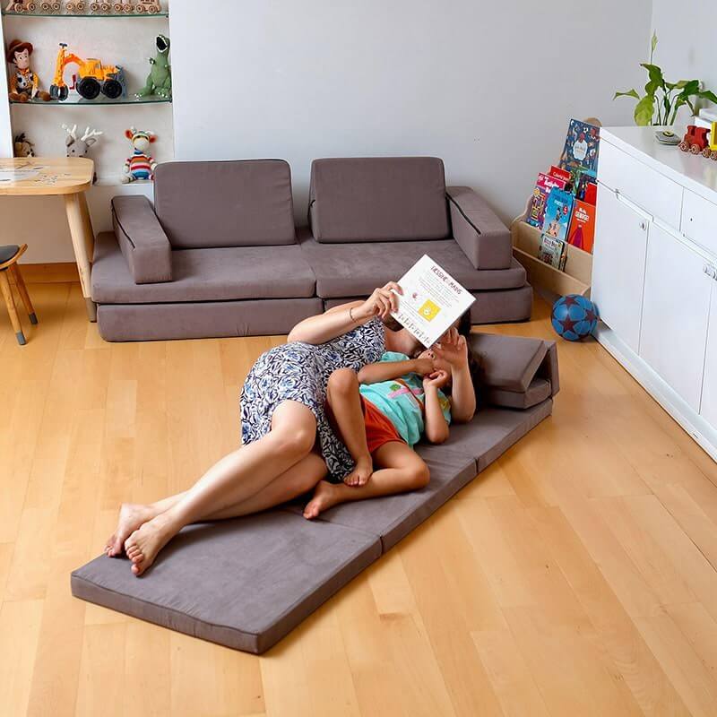 Kidodido Transformable Kids Play Mat and Couch - Multipurpose Baby Play Mat and Kids Couch Brown Mother And Son Reading While Lying Down