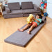 Kidodido Transformable Kids Play Mat and Couch - Multipurpose Baby Play Mat and Kids Couch Brown Showing A Kid Playing With Stuffed Toy