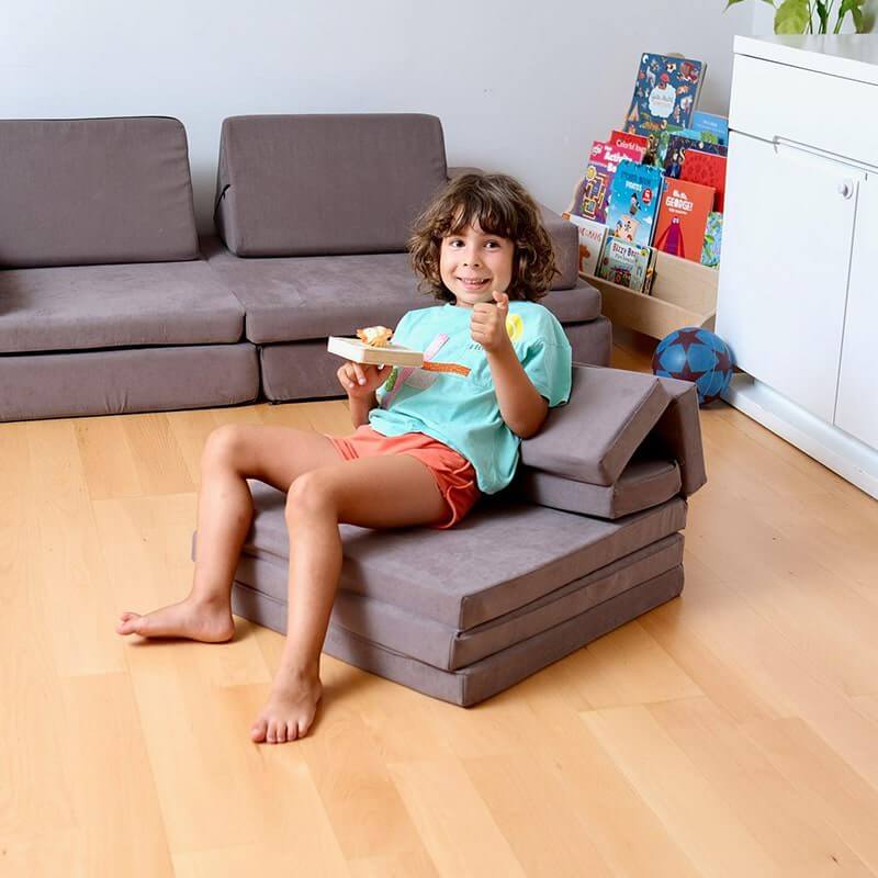 Kidodido Transformable Kids Play Mat and Couch - Multipurpose Baby Play Mat and Kids Couch Brown Showing A Kid Sitting