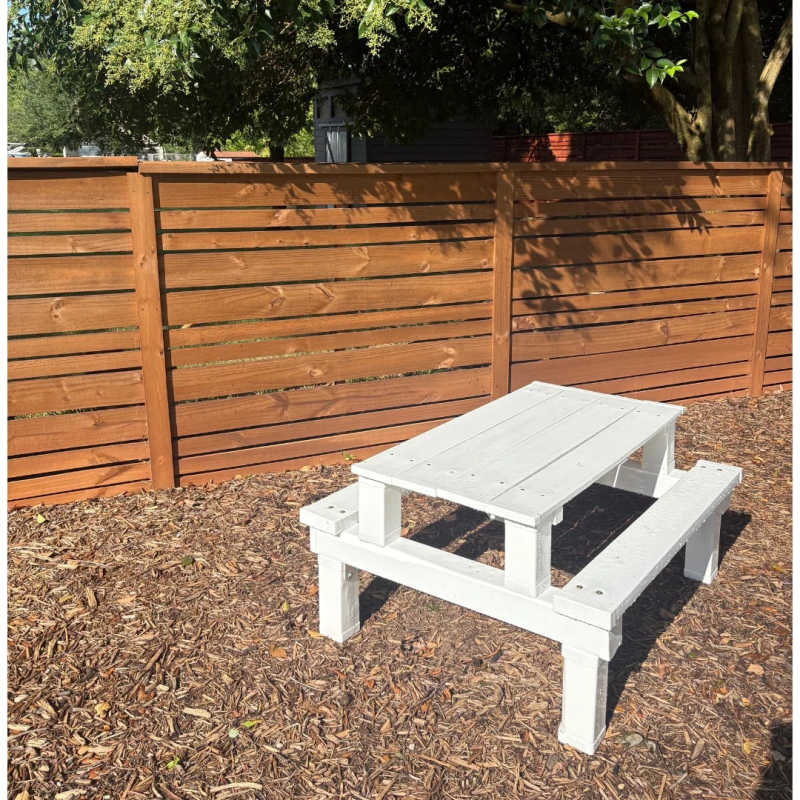 White Poly Kids Picnic Table in a yard